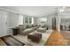 Spacious living room with a large sectional sofa and natural light at 621 Harper Davis Rd, Lake Wylie, SC 29710