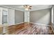 This is the main bedroom with hardwood floors, overhead ceiling fan, and access door to the bathroom at 621 Harper Davis Rd, Lake Wylie, SC 29710