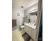 Neutral bathroom featuring a vanity, framed mirror, and tiled floors at 6212 Sunset Cir, Charlotte, NC 28216