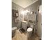 Bathroom features a white vanity with built in shelf over toilet at 6212 Sunset Cir, Charlotte, NC 28216