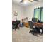 Bedroom setup as an office with wood desks, shelving, and rolling chairs at 6212 Sunset Cir, Charlotte, NC 28216
