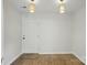 Inviting entryway with modern lighting, hardwood floors, and a neutral color palette at 6307 Old Corral St, Charlotte, NC 28277