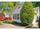 Charming home exterior with manicured landscaping, mature trees, and a well-maintained lawn at 6307 Old Corral St, Charlotte, NC 28277