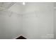 Empty walk-in closet features wire shelving for organization at 6307 Old Corral St, Charlotte, NC 28277