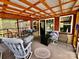 This is a spacious covered back porch with wood beams that provides a nice outdoor living space at 6401 Alley Rd, Catawba, NC 28609