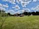 Large, green backyard features a well-maintained lawn, offering plenty of space for outdoor activities and enjoyment at 6401 Alley Rd, Catawba, NC 28609