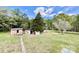 Large backyard with grass and trees and a shed providing additional storage space at 6401 Alley Rd, Catawba, NC 28609