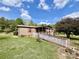 Cozy home featuring a convenient access ramp, red shutters, and a spacious lawn at 6401 Alley Rd, Catawba, NC 28609