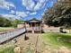 Ranch style home with a charming front porch and ramp, surrounded by a well-maintained lawn and natural landscaping at 6401 Alley Rd, Catawba, NC 28609