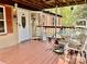 Cozy front porch features a white door, outdoor seating, and classic design at 6401 Alley Rd, Catawba, NC 28609