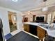 The kitchen has wood cabinets, black appliances, and a view of the open-concept living area at 6401 Alley Rd, Catawba, NC 28609