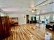 Spacious living room featuring wood floors, sliding doors, and access to the outdoors at 6401 Alley Rd, Catawba, NC 28609