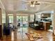 An open concept living room with laminate floors, lots of light, access to the outside, and an open kitchen at 6401 Alley Rd, Catawba, NC 28609
