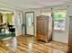 A living room with light gray walls, wood floors, two windows, and a door to the outside at 6401 Alley Rd, Catawba, NC 28609