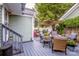 Cozy backyard patio featuring comfortable seating, fire pit, umbrella, and lush greenery, perfect for relaxation at 6726 Park Meadows Pl, Huntersville, NC 28078