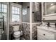 Charming bathroom featuring a tiled shower, patterned tile accent, and a stylish gray color palette at 6726 Park Meadows Pl, Huntersville, NC 28078