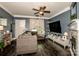 Cozy living room, dark wood floors, comfortable sofa and loveseat and a fireplace at 6726 Park Meadows Pl, Huntersville, NC 28078