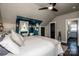 Relaxing bedroom featuring a sitting area, ensuite bathroom, and natural light at 6726 Park Meadows Pl, Huntersville, NC 28078