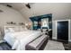 Bright bedroom with a seating area, sloped ceilings, and neutral tones at 6726 Park Meadows Pl, Huntersville, NC 28078