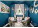 Charming sitting area with plush chairs, unique lighting, and a tranquil setting at 6726 Park Meadows Pl, Huntersville, NC 28078