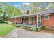 Inviting covered back porch with comfortable seating, grill, and easy access to the yard at 722 12Th Nw Ave, Hickory, NC 28601