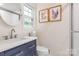 Modern bathroom with a new sink, updated fixtures, and natural light from a window at 722 12Th Nw Ave, Hickory, NC 28601