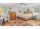 Bright bedroom features hardwood floors, ceiling fan, and large windows for natural light at 722 12Th Nw Ave, Hickory, NC 28601