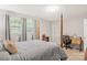 Well-lit bedroom with a four-poster bed, large windows, and ample natural light at 722 12Th Nw Ave, Hickory, NC 28601