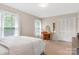 Bright bedroom with hardwood floors, carpet, large windows, and closet at 722 12Th Nw Ave, Hickory, NC 28601