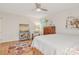 This bedroom features hardwood floors, a ceiling fan, and natural light at 722 12Th Nw Ave, Hickory, NC 28601