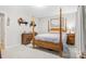 Comfortable bedroom with four-poster bed, carpet, and wood furnishings at 722 12Th Nw Ave, Hickory, NC 28601