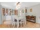 Bright dining room with built-in display cabinets and modern lighting at 722 12Th Nw Ave, Hickory, NC 28601