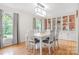 Bright dining room with stylish light fixture and built-in display cabinets at 722 12Th Nw Ave, Hickory, NC 28601