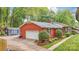 Charming brick home with a detached garage, shed, well-maintained landscaping, and long driveway at 722 12Th Nw Ave, Hickory, NC 28601