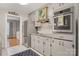 Galley kitchen features stainless steel appliances, shaker cabinets, and granite countertops at 722 12Th Nw Ave, Hickory, NC 28601