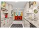 Galley kitchen features stainless steel appliances, shaker cabinets, and granite countertops at 722 12Th Nw Ave, Hickory, NC 28601