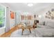 Bright living room with hardwood floors, comfortable seating, and built-in dining display at 722 12Th Nw Ave, Hickory, NC 28601