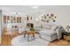 Bright living room with plush seating, hardwood floors, and decorative wall plates at 722 12Th Nw Ave, Hickory, NC 28601