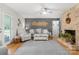 Comfortable living room featuring hardwood floors, fireplace, gray accent wall, and lots of natural light at 722 12Th Nw Ave, Hickory, NC 28601