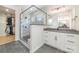 This stylish bathroom features a glass shower enclosure and a dual sink vanity at 8011 Green Heron Ct, Belmont, NC 28012