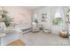 Serene Bedroom with a crib, changing table, and a cozy reading nook at 8011 Green Heron Ct, Belmont, NC 28012