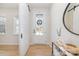 Bright foyer featuring a glass front door, rustic wreath, accent table, and a barn door at 8011 Green Heron Ct, Belmont, NC 28012