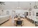 Bright open concept dining area with modern kitchen, stainless appliances and hardwood flooring at 8011 Green Heron Ct, Belmont, NC 28012