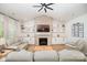 Cozy living room with brick fireplace, built-in shelves, recessed lighting, and comfortable seating at 8011 Green Heron Ct, Belmont, NC 28012