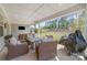 Covered patio with seating, propane heater and grill overlooking the private backyard at 8011 Green Heron Ct, Belmont, NC 28012