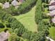 Aerial view of a baseball field surrounded by mature trees in a residential neighborhood at 8169 Clems Branch Rd, Indian Land, SC 29707