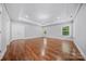 Spacious primary bedroom features hardwood floors, recessed lighting, and abundant natural light at 8169 Clems Branch Rd, Indian Land, SC 29707