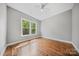 Bright bedroom filled with natural light features hardwood floors and neutral wall color at 8169 Clems Branch Rd, Indian Land, SC 29707