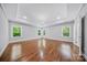 Spacious primary bedroom features hardwood floors, recessed lighting, and abundant natural light at 8169 Clems Branch Rd, Indian Land, SC 29707