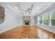 Open living room with coffered ceilings, fireplace, and hardwood floors, offering a comfortable space at 8169 Clems Branch Rd, Indian Land, SC 29707
